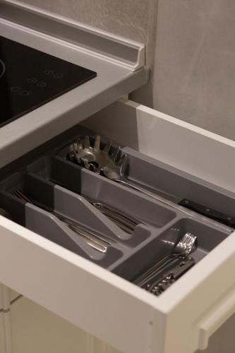 a drawer in a kitchen with a stove at Amaryllis Luxury Rooms in Platamonas