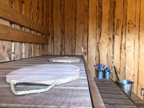 a room with three mattresses on a wooden floor at Pühajõe Holiday Park in Pühajõe