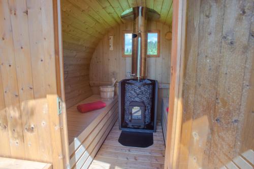 a inside of a sauna with a stove in it at Hotel Polar Star in Žabljak