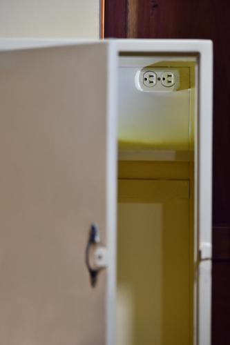 a door with a door knob on it with a door at La Brisa Loca Hostel in Santa Marta