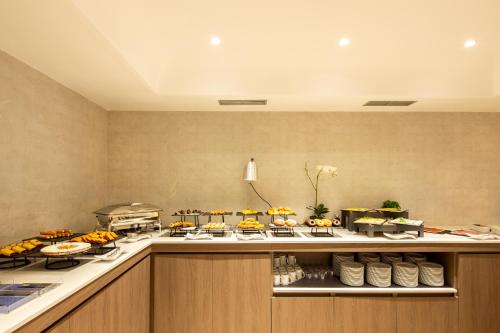 a buffet line with many food items on at Eurostars Gran Hotel Lugo in Lugo