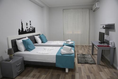 Postel nebo postele na pokoji v ubytování Hotel New York