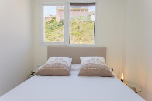 Ένα ή περισσότερα κρεβάτια σε δωμάτιο στο Dosel beach Apartment Cullera