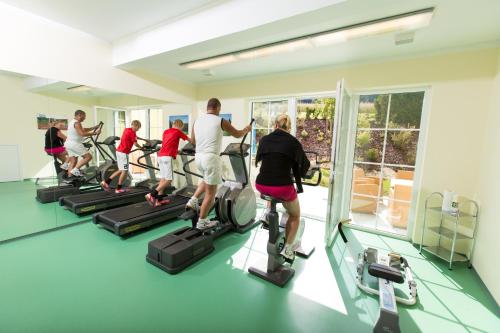 a group of people on treadmills in a gym at Gasthof-Pension Nordwald in Harbach
