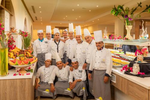 a group of chefs posing for a picture in a kitchen at Ulysse Thalasso & Spa - All Inclusive in Houmt Souk