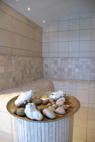 a bowl of rocks on a table in a room at Hotel Marina in Grenå