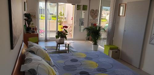 Ένα ή περισσότερα κρεβάτια σε δωμάτιο στο Chambres d'hôtes Chez Pat et Nanou