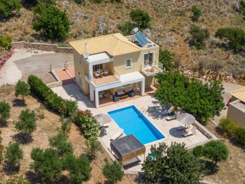 an aerial view of a house with a swimming pool at Astra Villas in Skala Kefalonias