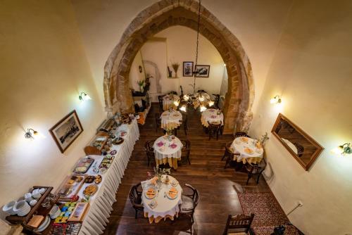 an overhead view of a dining room with tables and chairs at Porto Del Colombo Traditional Boutique Hotel in Chania Town