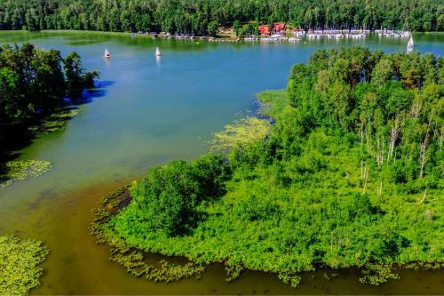 an aerial view of a lake with boats in it at Apartament Na Wodzie in Ruciane-Nida