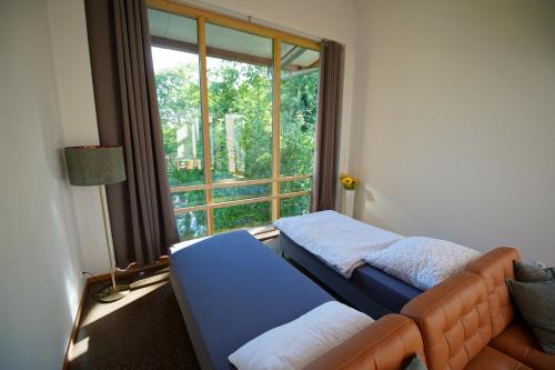 Llit o llits en una habitació de Gästewohnung Hardinghaus am Teich