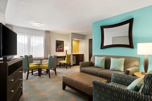 a living room with a couch and a table at The Inn at Saint Mary's in South Bend