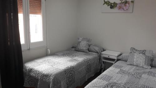 Ένα ή περισσότερα κρεβάτια σε δωμάτιο στο loft turistic