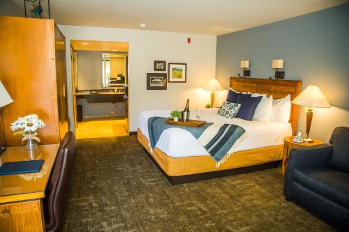a hotel room with a bed and a couch at Adelaide Inn in Paso Robles