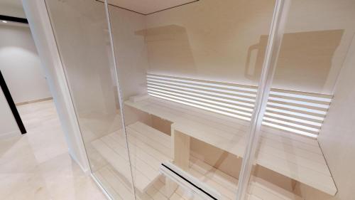a glass walk in shower in a room at White Pearl Apartment 1.12 in Timmendorfer Strand