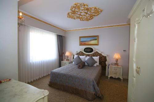 Posteľ alebo postele v izbe v ubytovaní Demir Hotel