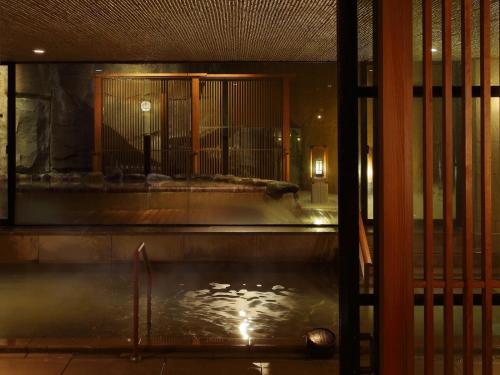 a pool of water inside of a building at Aki Grand Hotel & Spa in Miyajima