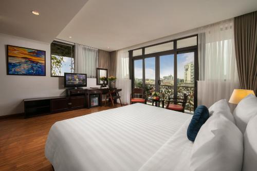 Postel nebo postele na pokoji v ubytování Hotel De La Seine