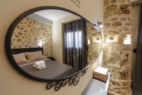 Llit o llits en una habitació de To Petrino (VIlla Markos)