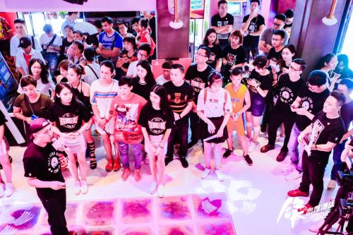 a group of people standing in front of a crowd at Fenk Attitude Hotel Guangzhou Railway Station in Guangzhou