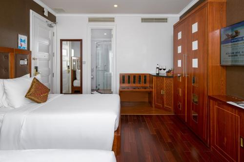 Ένα ή περισσότερα κρεβάτια σε δωμάτιο στο Samdi Da Nang Central Hotel