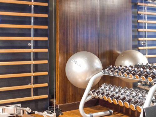 a room with a rack of dumbbells at Sofitel Montevideo Casino Carrasco & Spa in Montevideo