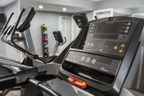 a digital screen on a treadmill in a gym at Days Inn by Wyndham Saint John in Saint John