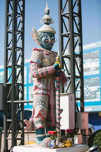a statue of a person standing on a stage at Best Western Royal Buriram in Buriram