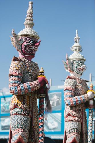 two statues of two people dressed in costumes at Best Western Royal Buriram in Buriram