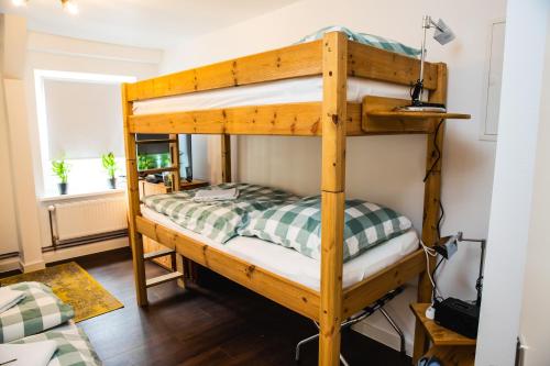 a room with two bunk beds in a room at St Pauli CITY Apartment in Hamburg