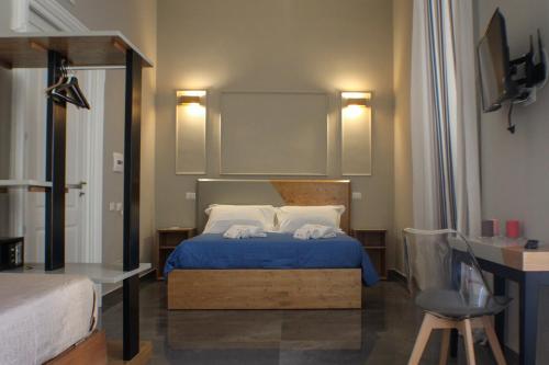 Posteľ alebo postele v izbe v ubytovaní Be Italian Flat Piazza Bovio 22