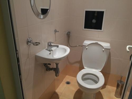 a bathroom with a toilet and a sink at Апартамент с две спални в комплекс Лъки 2 Свети Влас in Sveti Vlas