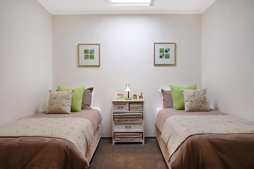A bed or beds in a room at Marctime - Woodlands
