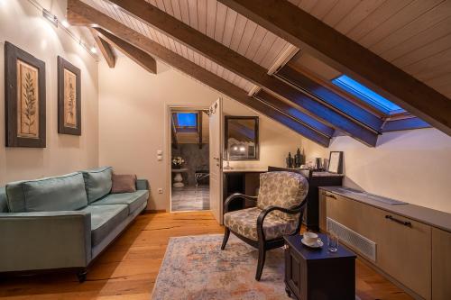 a living room with a couch and a chair at Hotel Antique in Ioannina