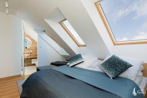 Posteľ alebo postele v izbe v ubytovaní Feniks SPA Apartments 10 by Jantar Apartamenty Kołobrzeg