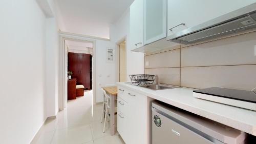 a kitchen with a sink and a counter top at Valentinos House in Parga
