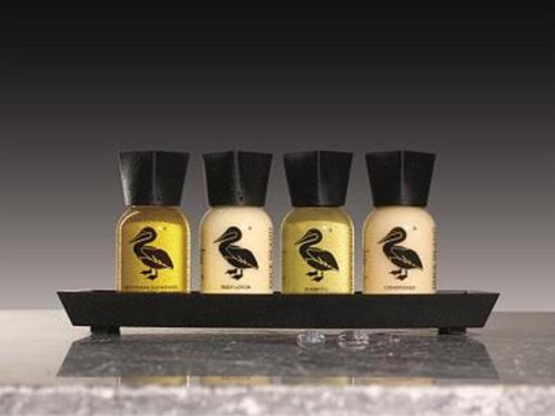 a group of four bottles of bird repellents on a shelf at The Inn @ Y-Not in Thurso