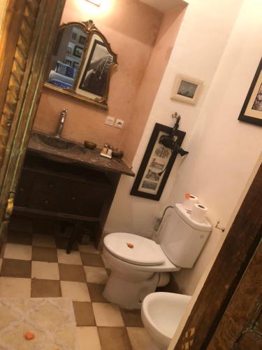 a bathroom with a toilet and a sink at Riad Le Coq Berbère in Marrakech