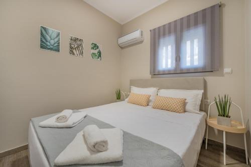 מיטה או מיטות בחדר ב-Cosy apartment in the heart of the city centre