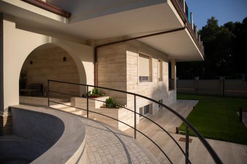 a house with a staircase leading to a patio at Aurum Suites in Pescara
