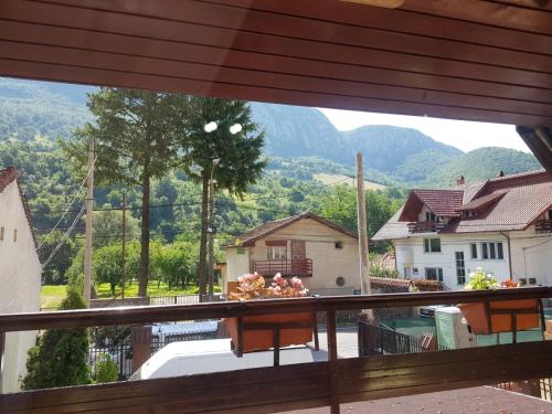 a view from the balcony of a house with mountains in the background at Casa Adriana in Băile Herculane