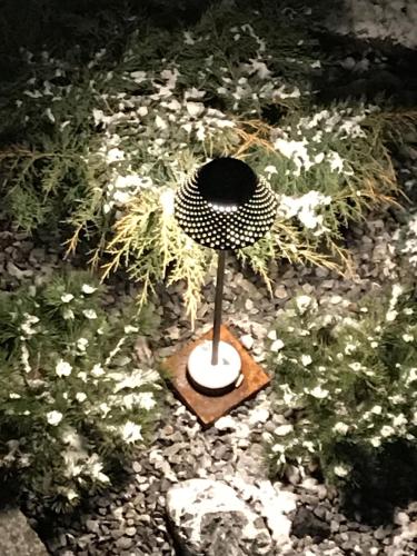 a black and white hat on a wooden stand at HOTEL AD Residence in Bormio