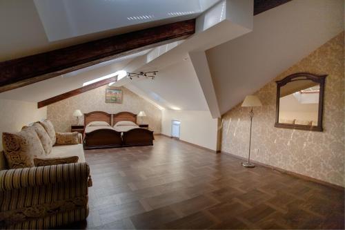 a large living room with a bed and a couch at Castle in Saint Petersburg