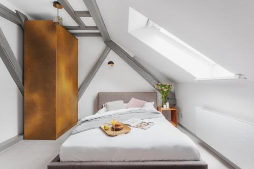 a bedroom with a bed with a tray on it at VISIONAPARTMENTS Cramerstrasse 2-6 - contactless check-in in Zürich