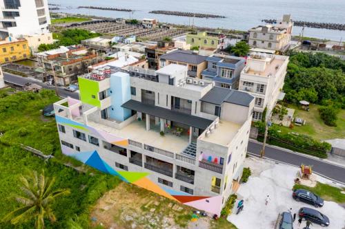 an aerial view of a building with a colorful facade at Relaxing Hotel in Donggang