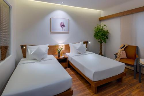 Ένα ή περισσότερα κρεβάτια σε δωμάτιο στο Silverland Min Hotel