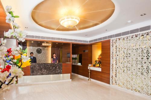 a lobby of a hotel with a large ceiling at Regenta Orko's Haridwar, Motichur, 10 min from Har ki Pauri in Haridwār