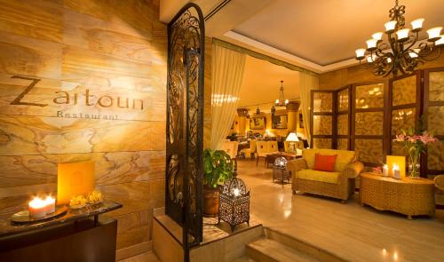 a lobby of a hotel with a sign on the wall at Danat Jebel Dhanna Resort in Jebel Dhanna