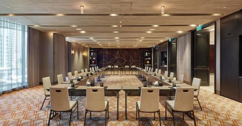 a large conference room with a long table and chairs at Hyatt Regency Bangkok Sukhumvit in Bangkok