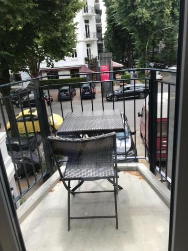 a chair and a table on a balcony at Apartmenthaus Hamburg Eppendorfer Weg in Hamburg